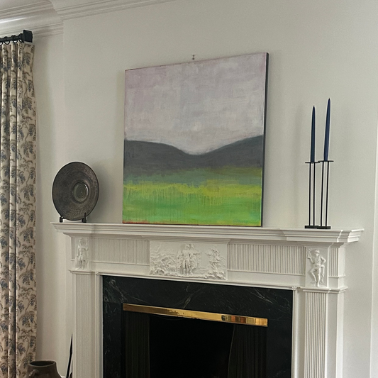 Living room with a fireplace, artwork, in collectors home