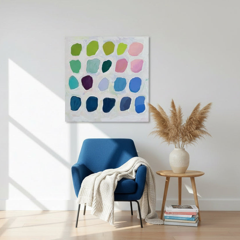 Color swatch card with various colored paint blobs on a white background