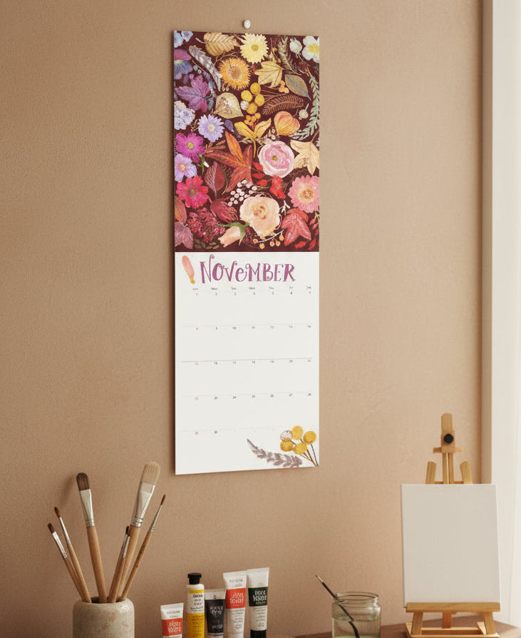 november calendar above desk with art supplies showing hand painted leaf pattern