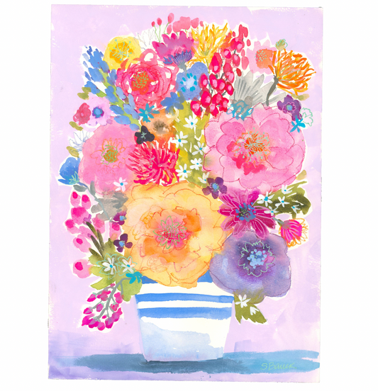 Colorful floral arrangement in a striped vase on a light purple background
