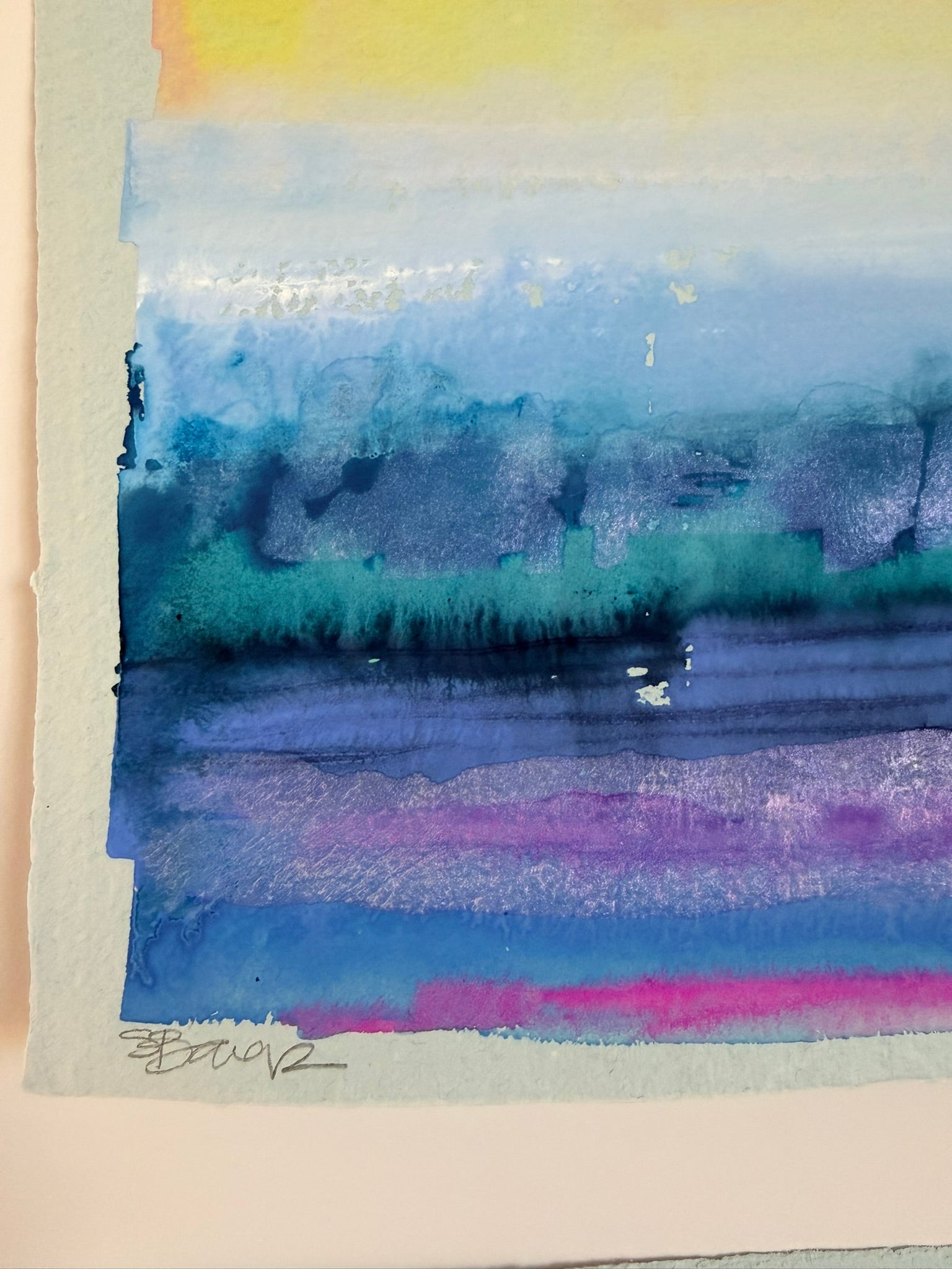 Abstract seascape watercolor painting with blue, purple, and green hues on a light background.
